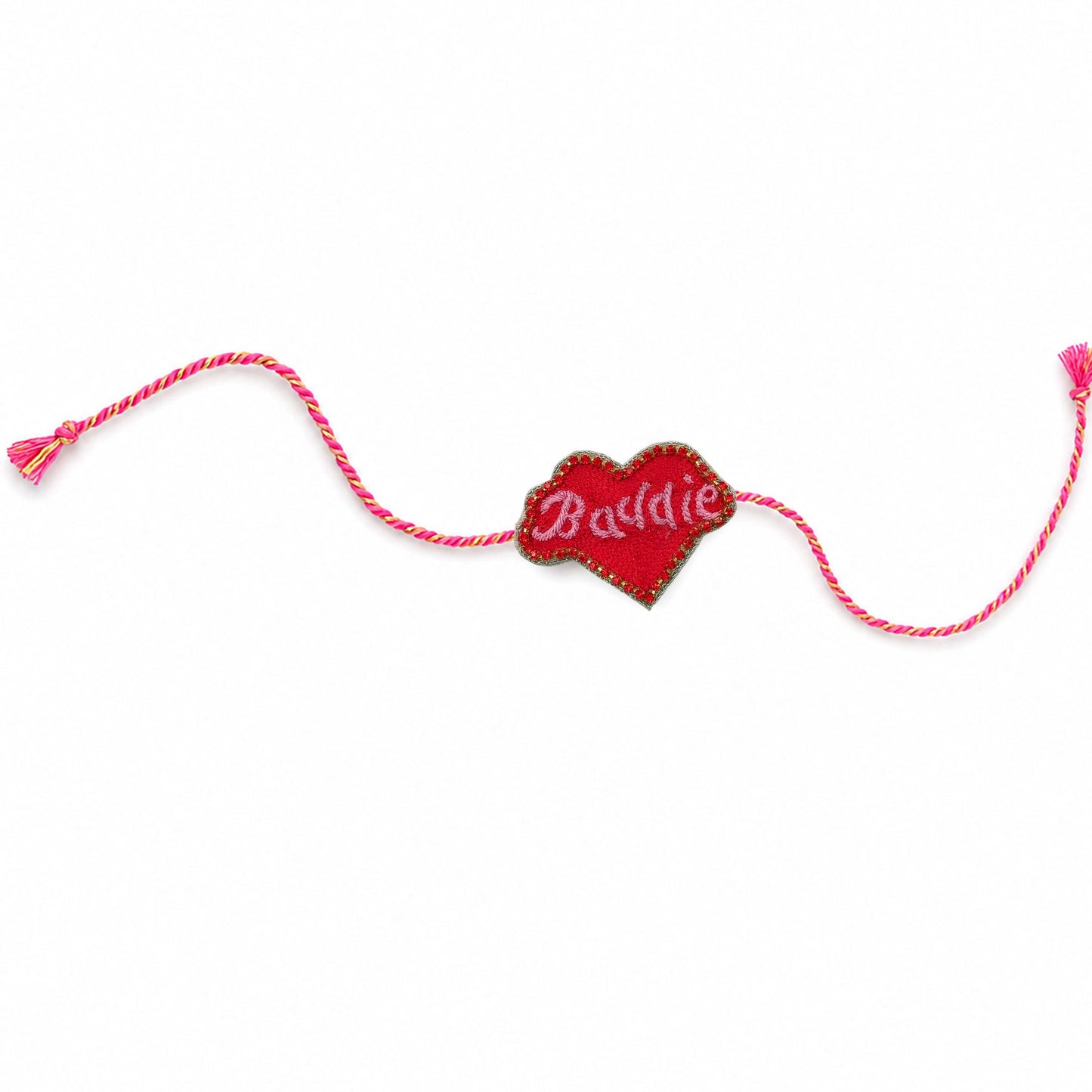 Detailed view of handcrafted red heart rakhi with golden border