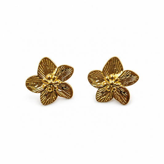Gold textured flower stud earrings pair on white background