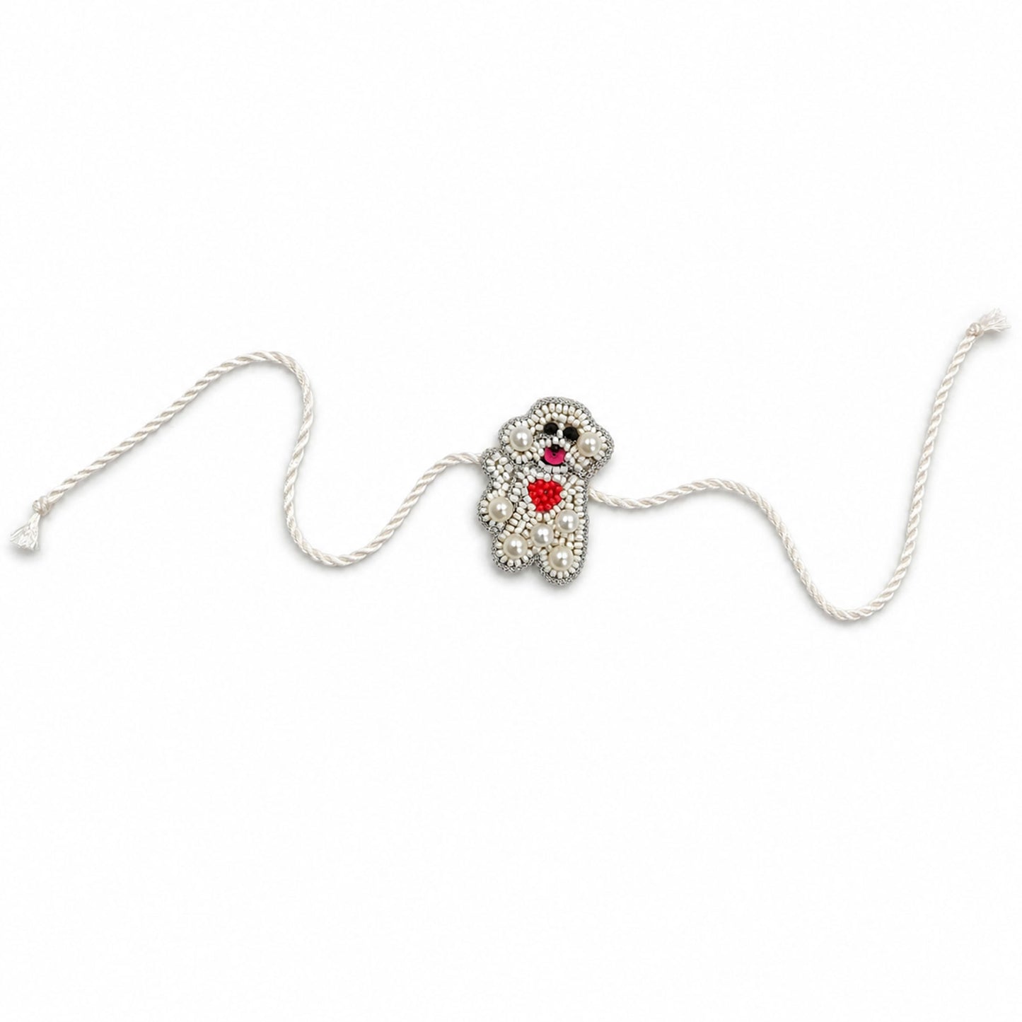 Detailed view of handcrafted pearl beaded teddy rakhi