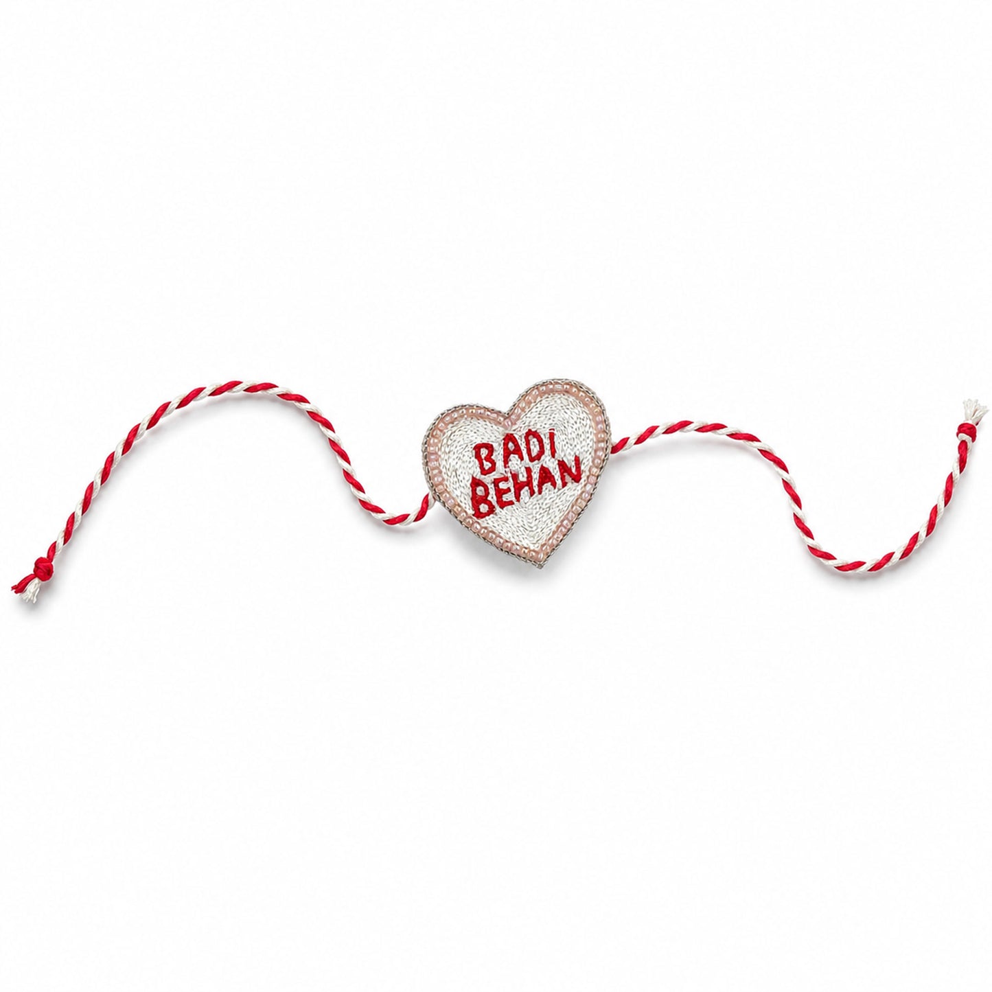 Heart-shaped Badi Behan rakhi with traditional thread design