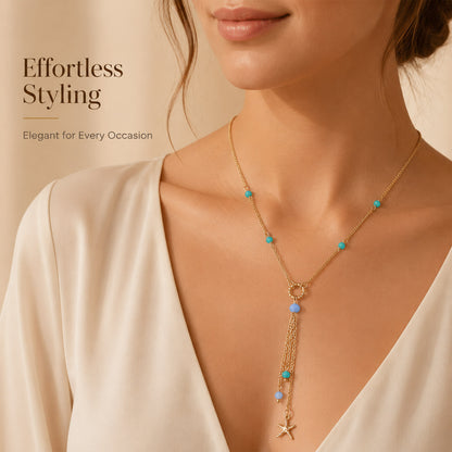 Close-up view of gold tassel necklace with turquoise beads
