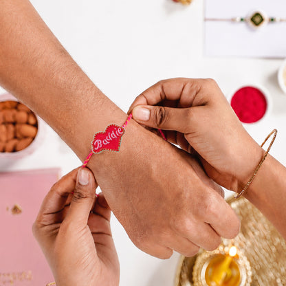Stylish Dorie heart rakhi with pink braided thread