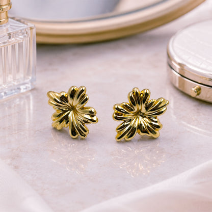 Gold floral earrings styled as elegant fashion jewellery for women
