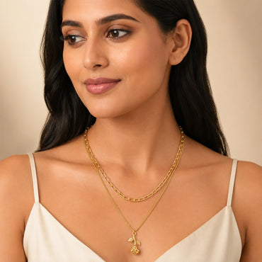 Close-up view of gold rose flower pendant necklace