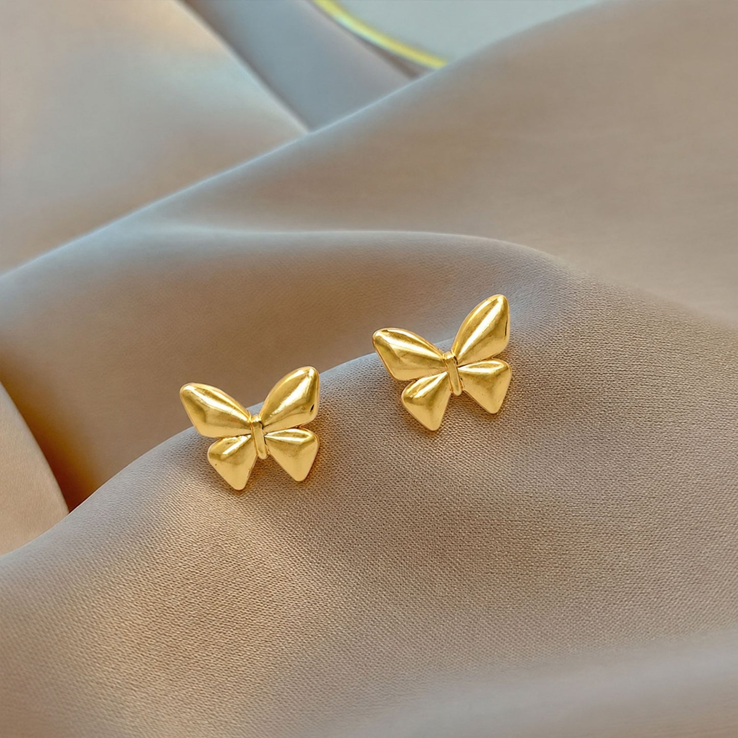 Gold plated butterfly stud earrings with sculpted wings