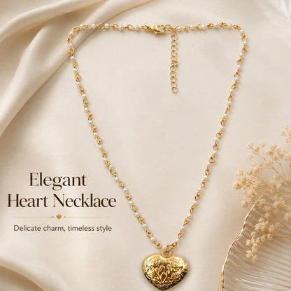 Gold pearl heart necklace styled as romantic fashion jewellery