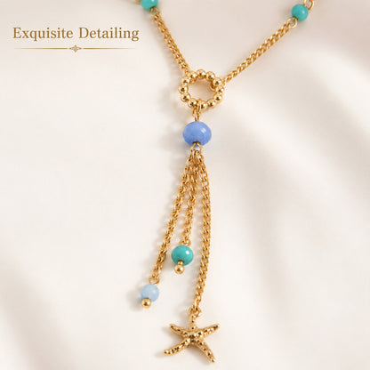 Gold plated starfish pendant necklace with blue bead accents