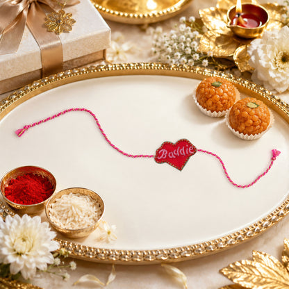Close-up view of Dorie heart rakhi with embroidered detailing