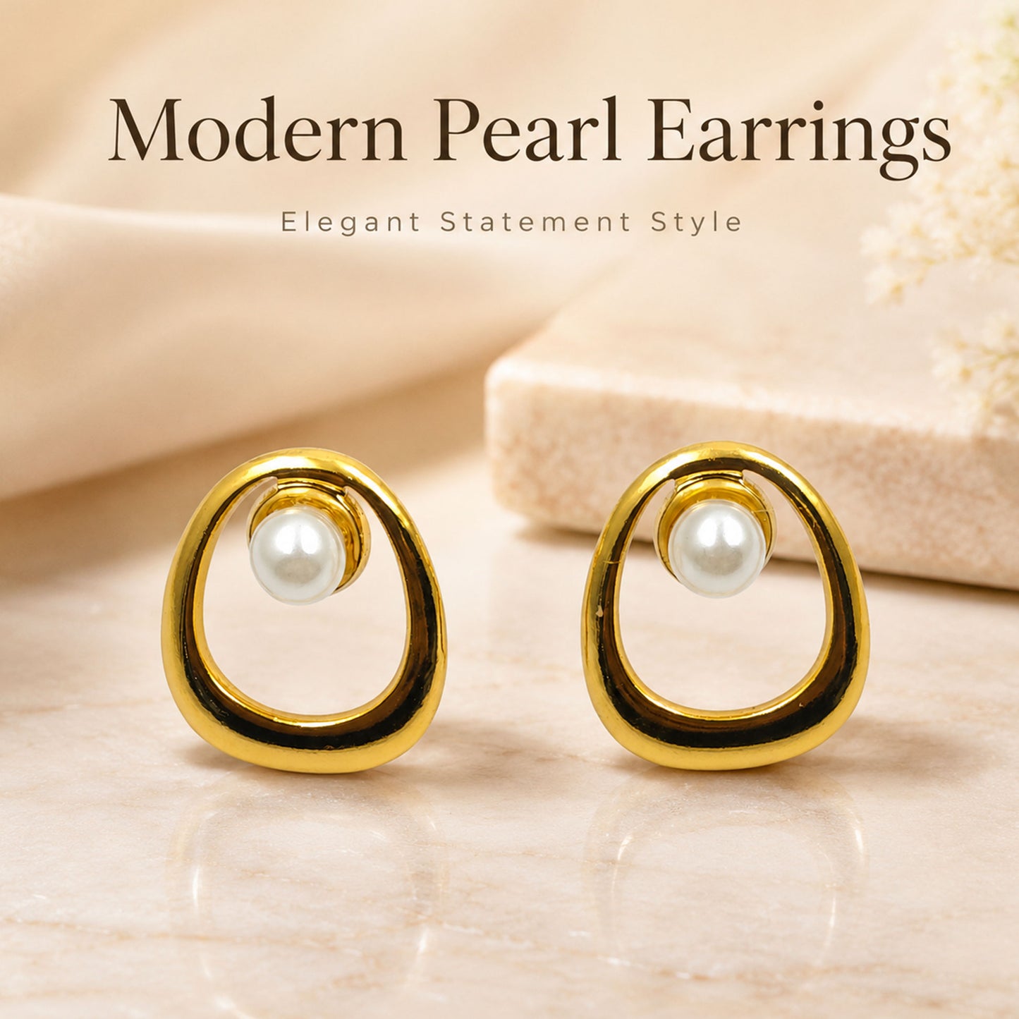 Detailed view of modern open oval gold stud earrings