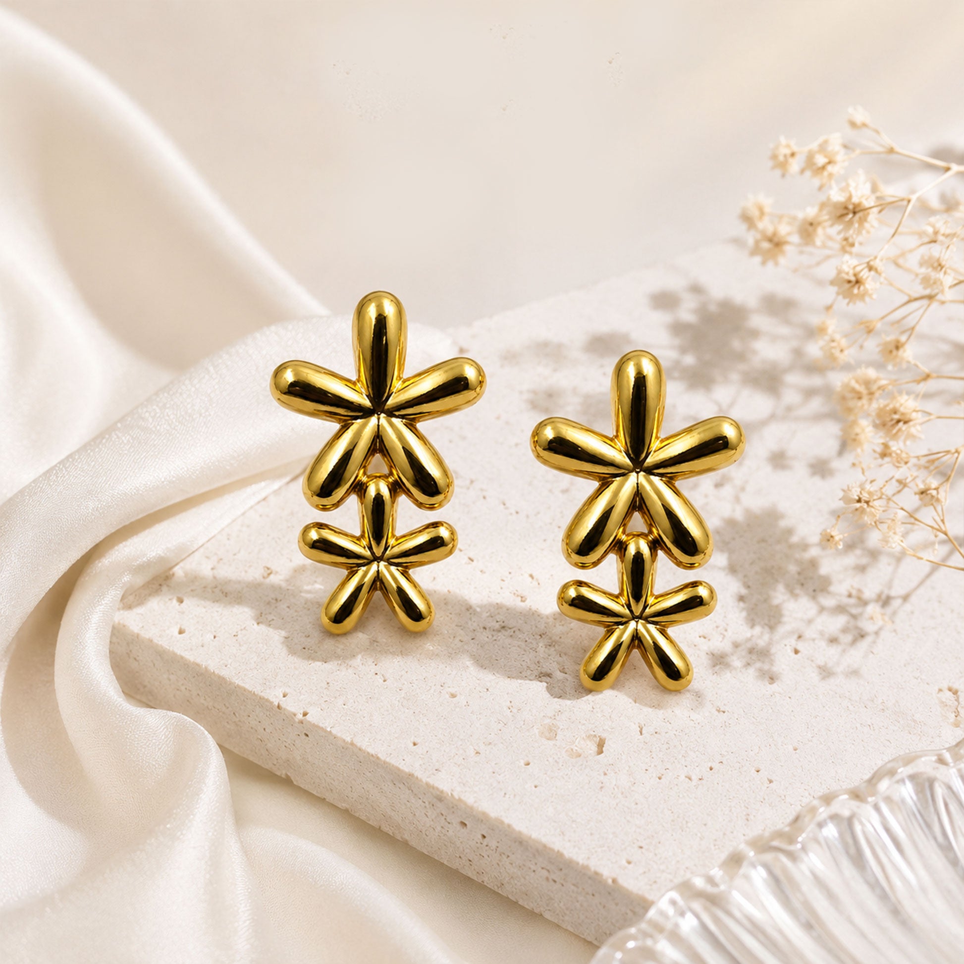 Gold plated two flower earrings with polished finish