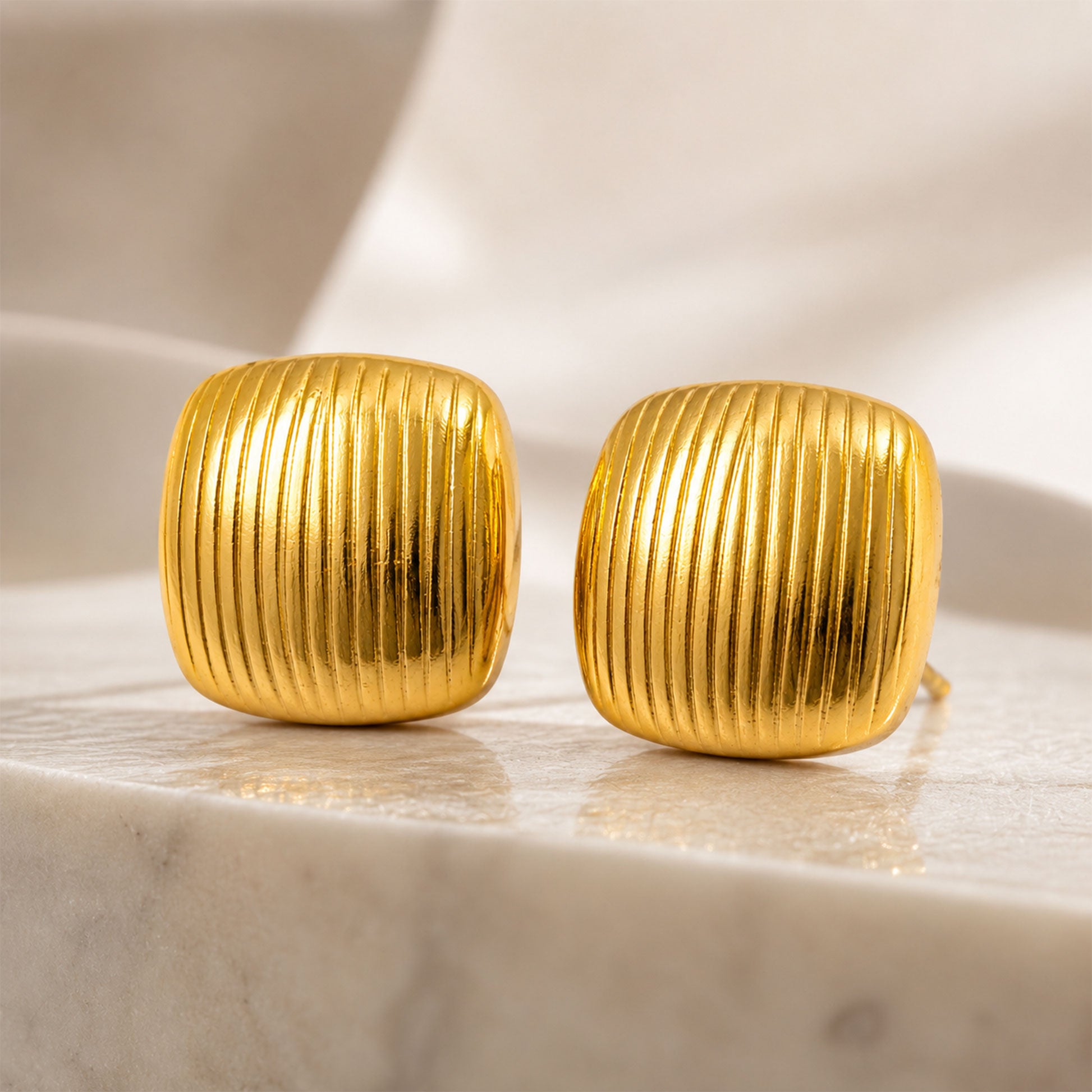 Gold plated chunky square stud earrings with polished finish