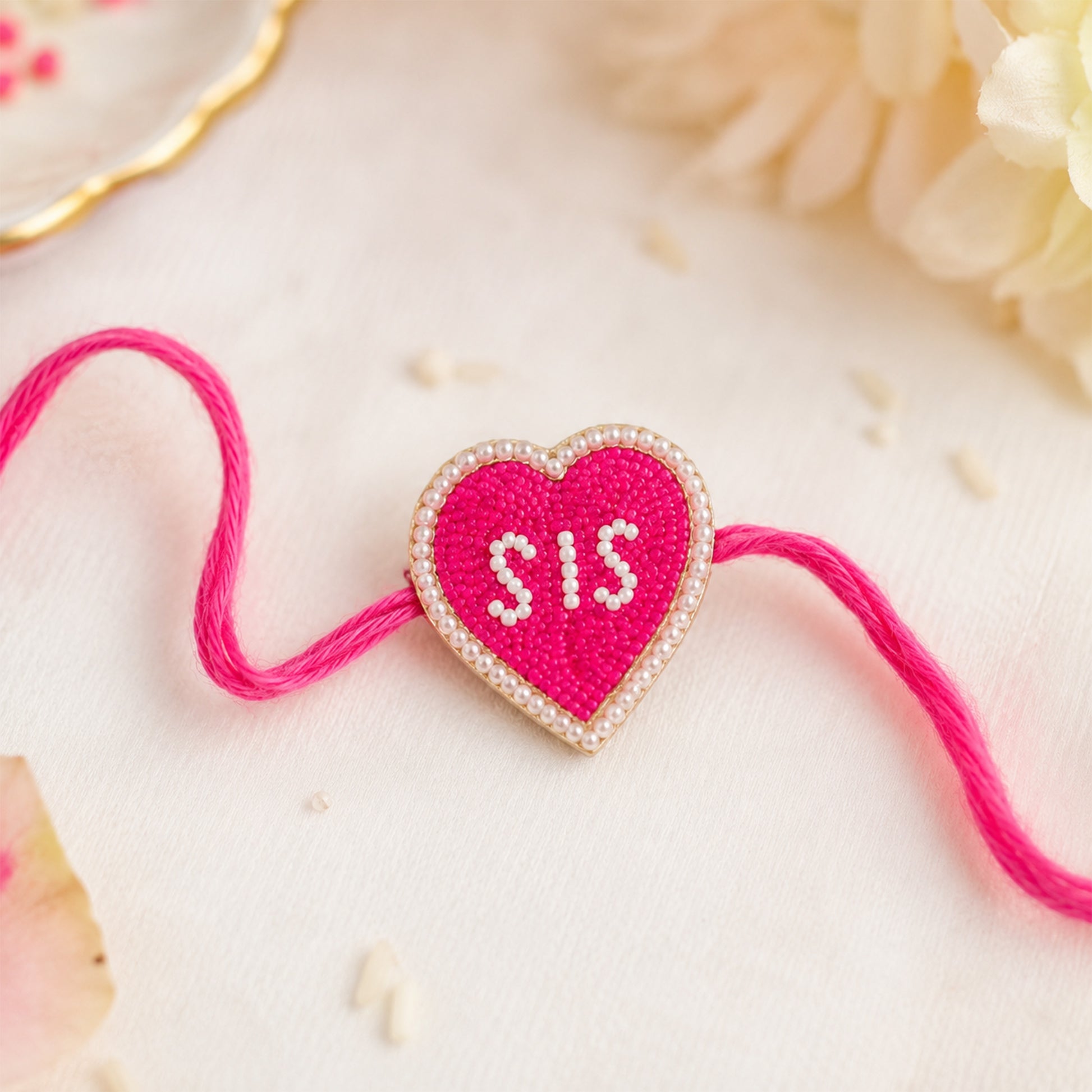 SIS heart rakhi on festive background