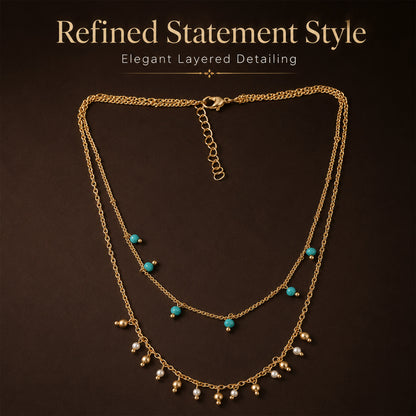 Detailed view of turquoise pearl and gold ball charm necklace