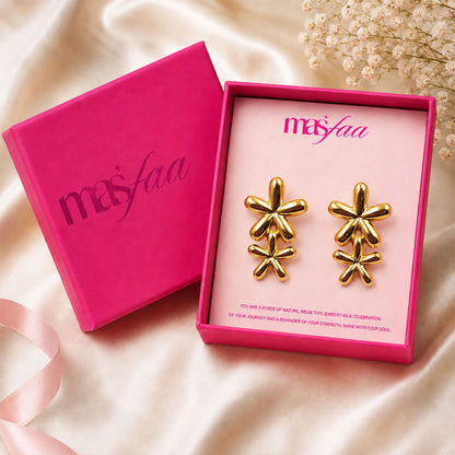 Gold floral drop earrings styled as modern fashion jewellery for women