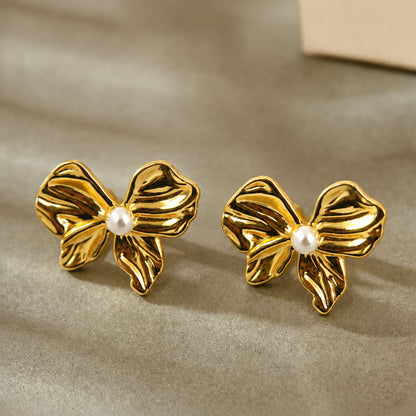 Gold plated bow stud earrings with textured detailing