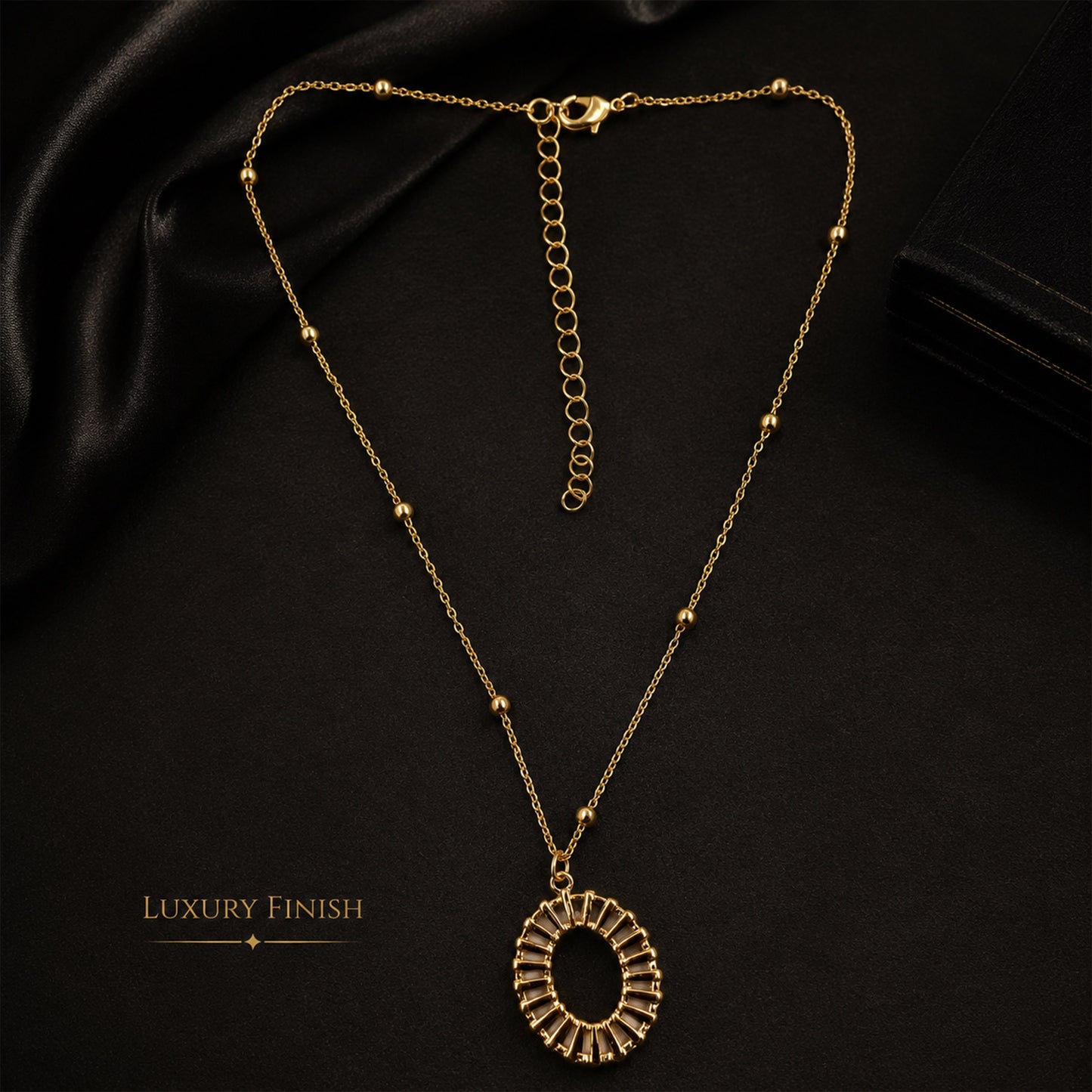 Detailed view of gold sunburst-inspired open pendant necklace