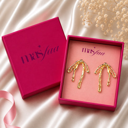 Gold branch earrings styled as modern fashion jewellery for women