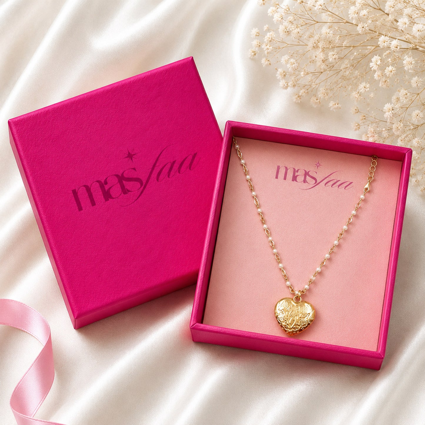 Detailed view of engraved heart pendant and decorative chain
