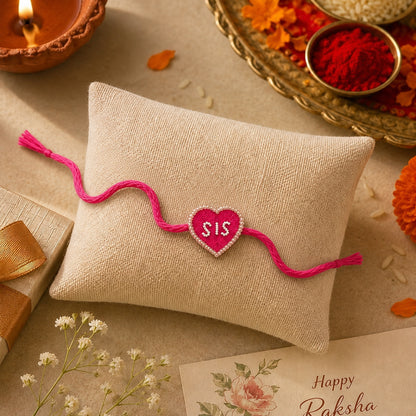 
Lightweight pink thread rakhi for sister festive gifting