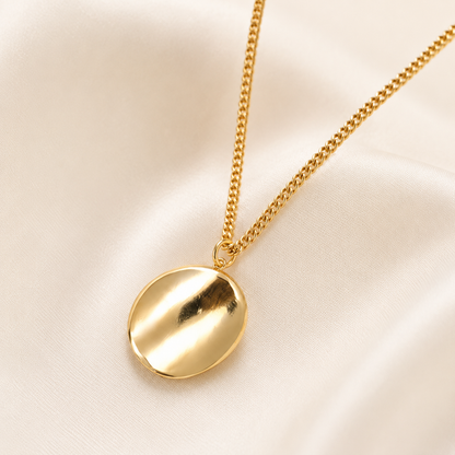Gold pendant necklace styled as elegant fashion jewellery