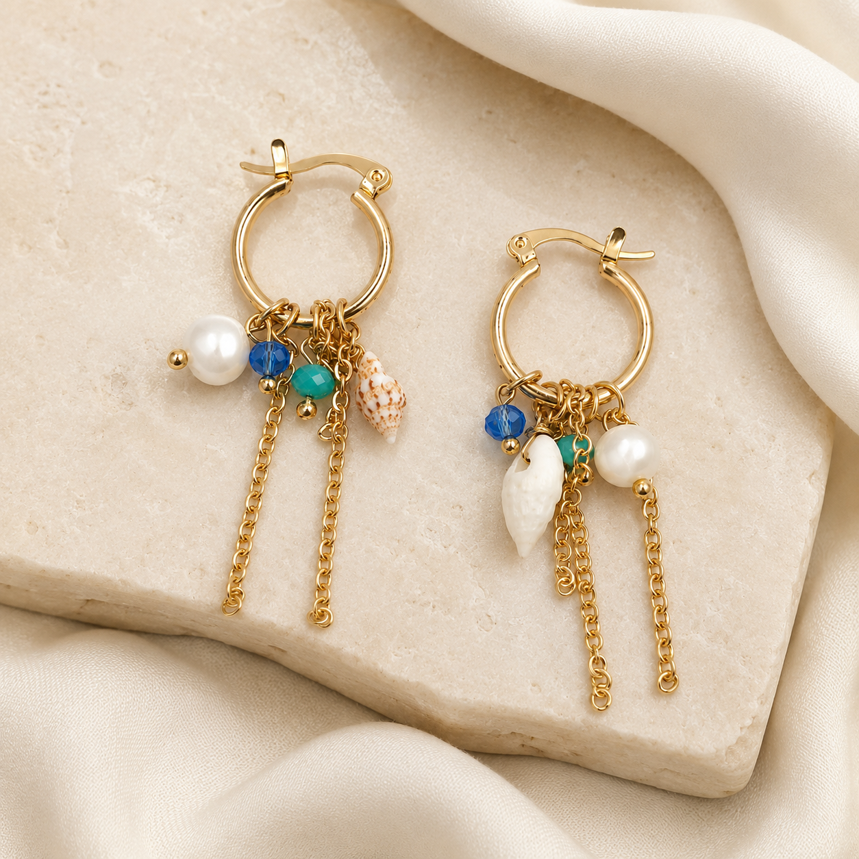 Gold plated hoop earrings with blue beads and chain tassels