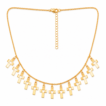 Gold cross heart charm necklace on white background