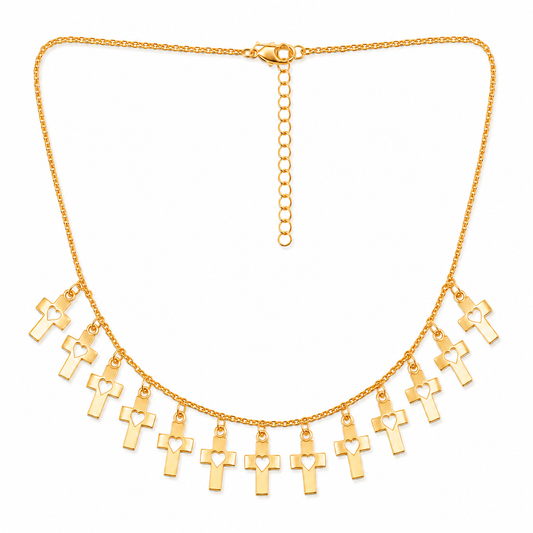 Gold cross heart charm necklace on white background