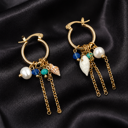 Gold beach-inspired hoop earrings styled as fashion jewellery