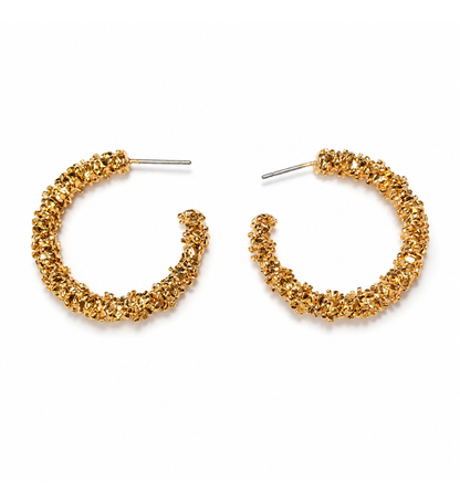 Gold textured hoop earrings pair on white background