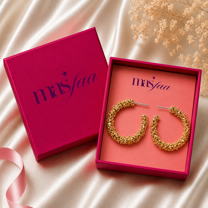 Gold textured hoops styled as modern fashion jewellery for women