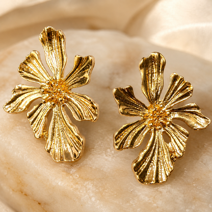 Gold flower earrings styled as elegant fashion jewellery for women