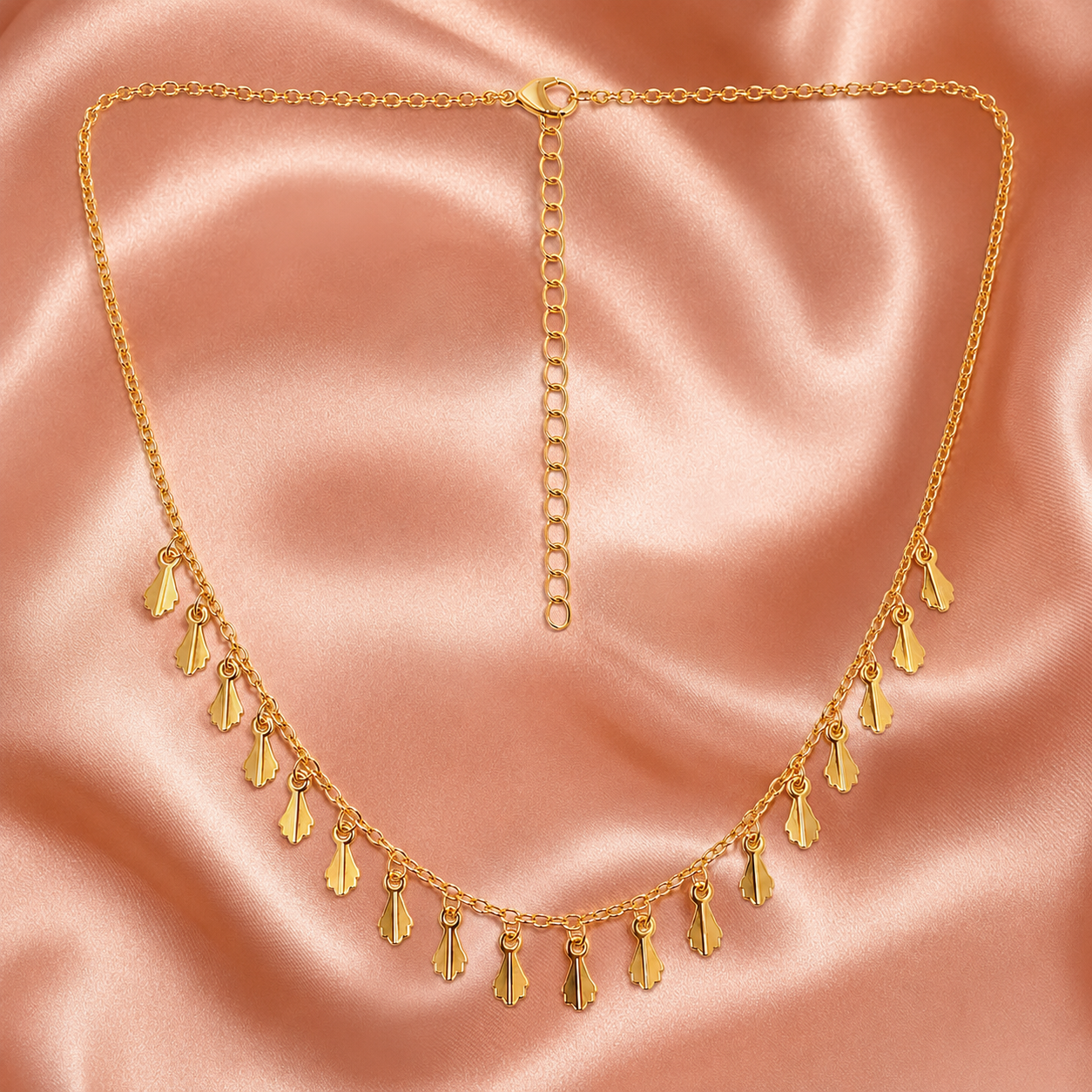 Detailed view of polished leaf charm necklace