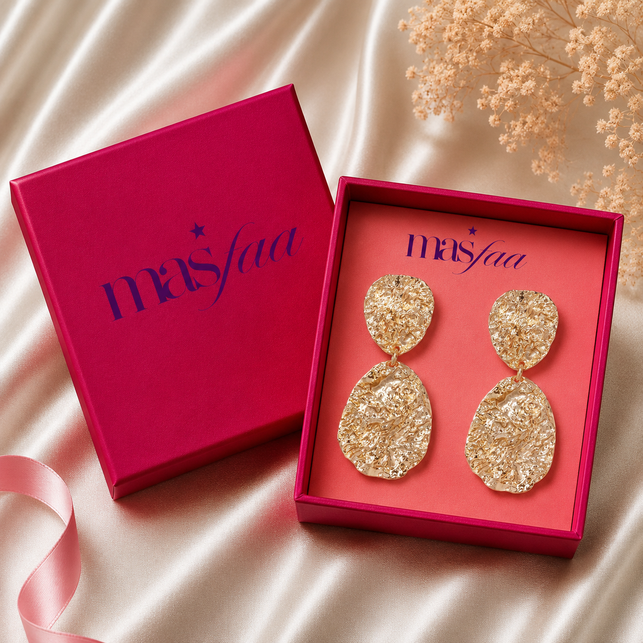 Close-up view of hammered teardrop earrings with polished finish