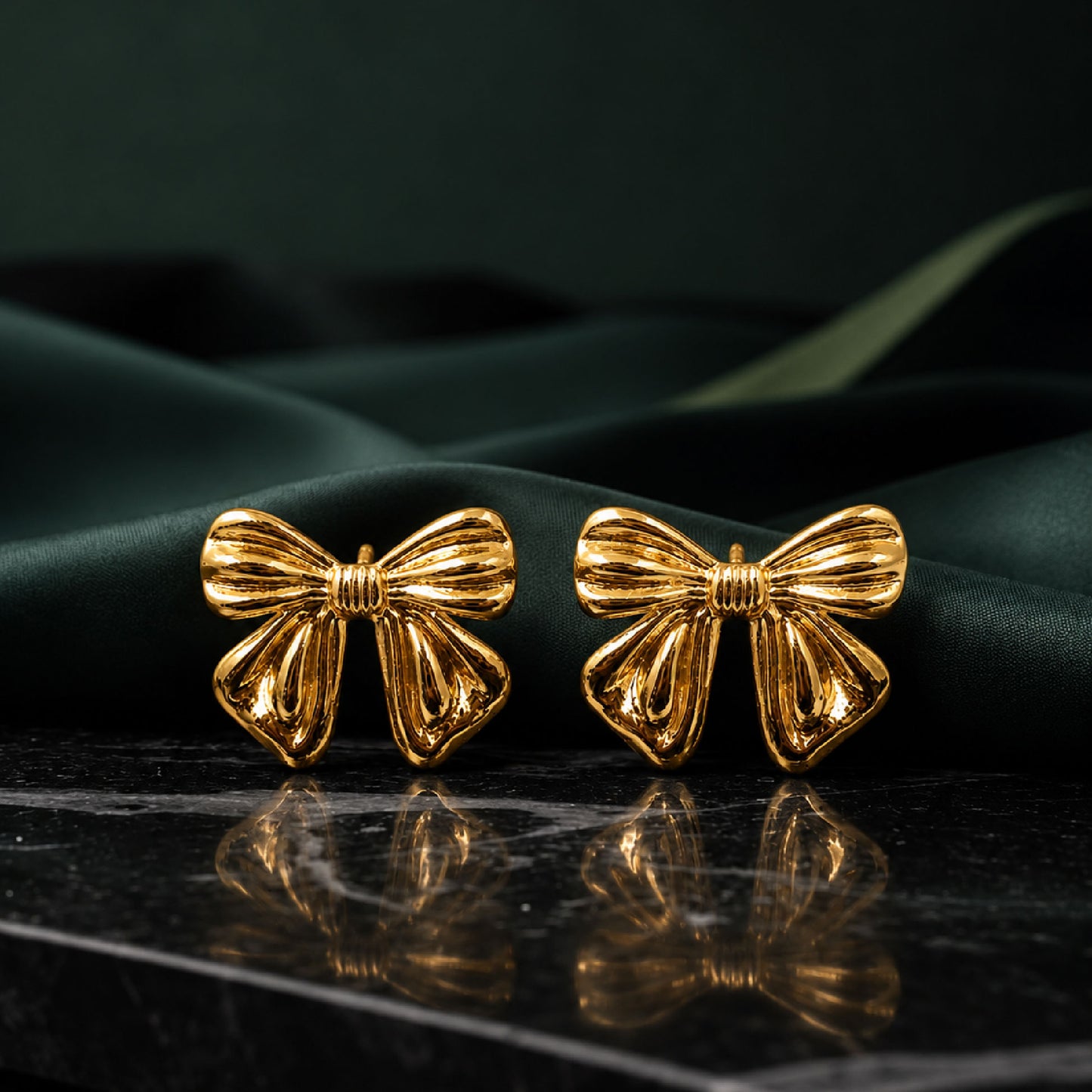 Gold bow earrings styled as cute fashion jewellery for women