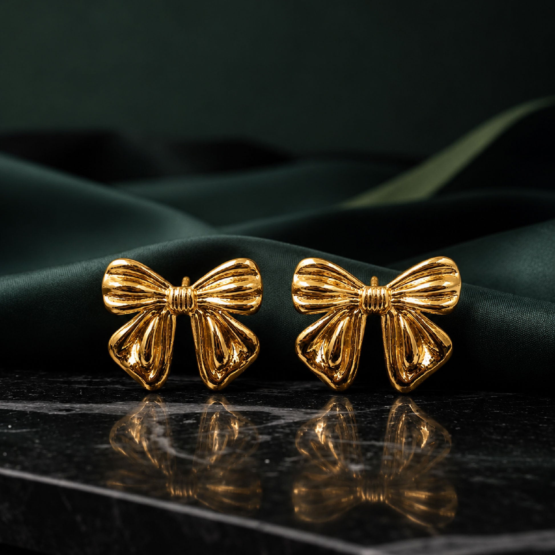 Gold bow earrings styled as cute fashion jewellery for women