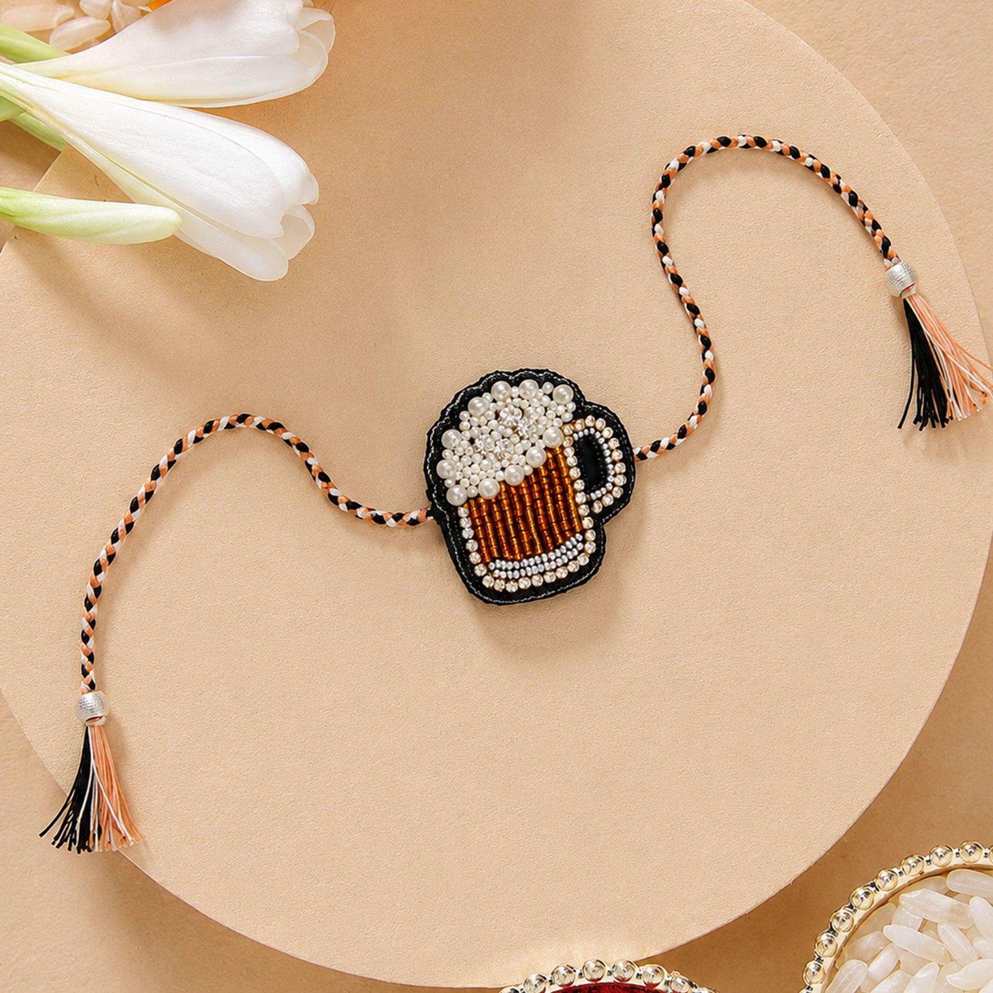 Black white beige braided thread rakhi with mug centerpiece