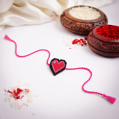 Cute heart design rakhi with bright pink braided thread