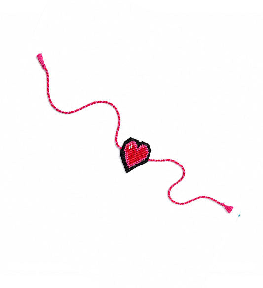 Pink heart beaded rakhi on white background