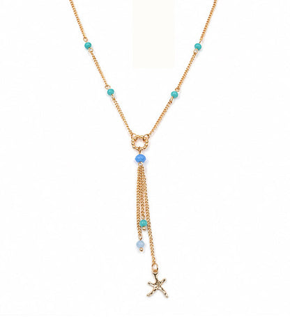 Gold blue beaded starfish tassel necklace on white background