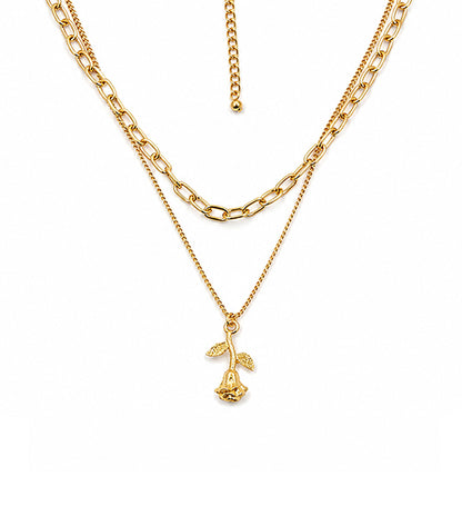 Gold layered rose pendant necklace on white background
