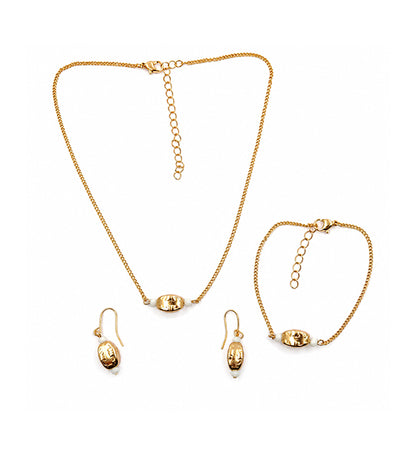 Gold oval bead jewellery set with necklace bracelet and earrings on white background