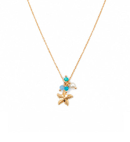 Gold starfish charm pendant necklace on white background