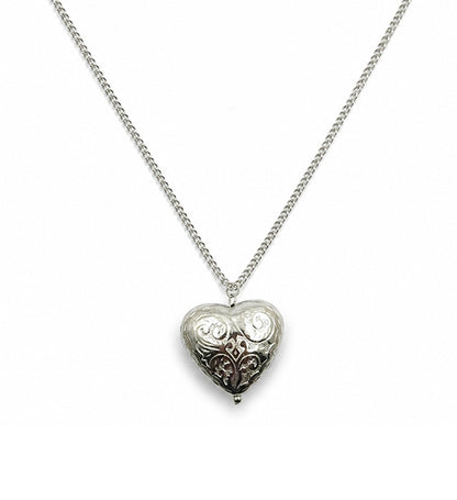 Silver engraved heart pendant necklace on white background